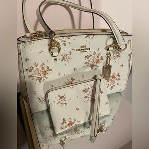 Brand new Coach purse with matching wristlet Floral print